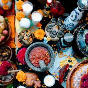 Featured image for Day of the Dead: altar with marigolds, candles, and sugar skulls.