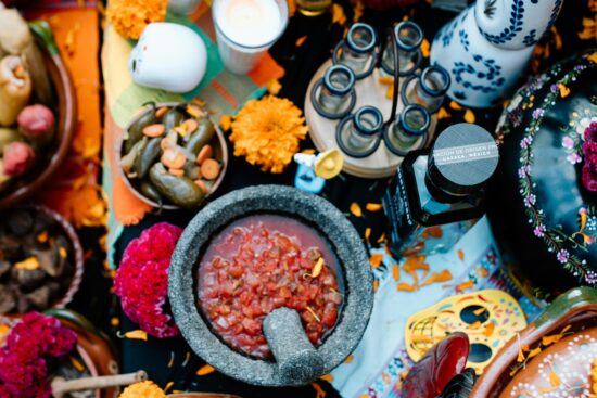 Featured image for Day of the Dead: altar with marigolds, candles, and sugar skulls.